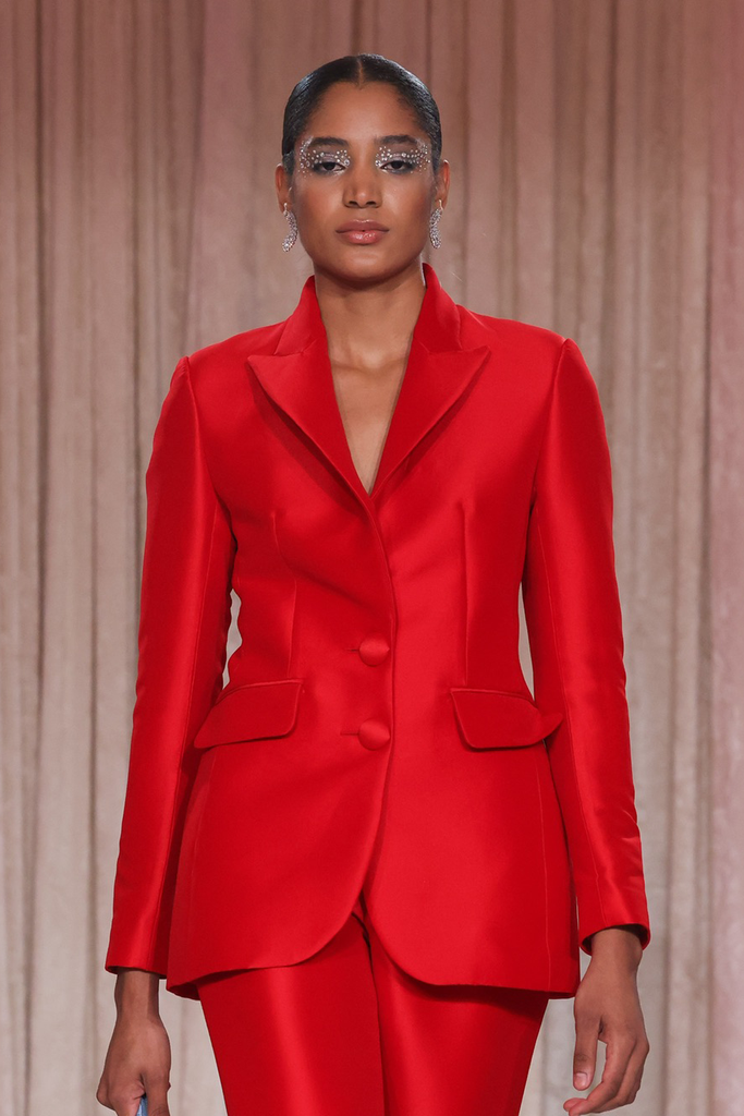 Nardos designed a radiant red pantsuit with sharp silhouette and bold resence.