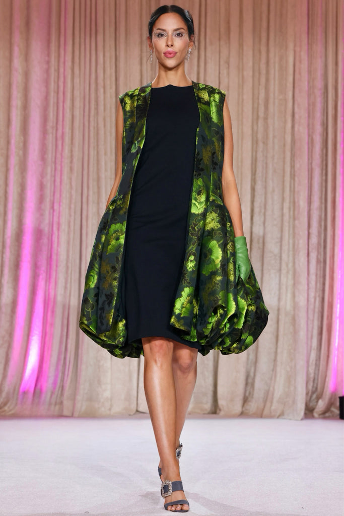 Nardos designed emerald Duster over a black sheath dress