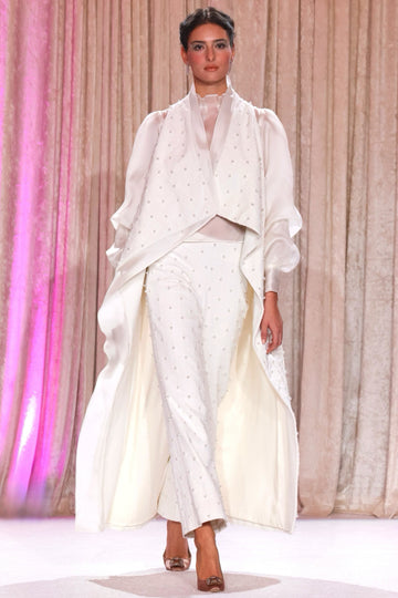 Nardos designed pearl beaded white duster complimented with a sheer white blouse and pearl beaded white pants