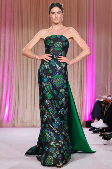 Nardos designed strapless gown with brocade green florals on a black fabric that is floor length and removable train