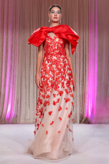 Nardos designed elegant organza layered gown with voluminous satin bow and a shower of red floral appliqués, a masterpiece of romance and drama.