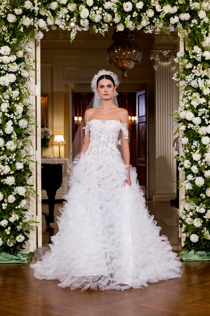 Nardos designed luxury bridal gown - Dallas, TX and New York, NY. Corset A-line gown with overflowing waves and floral sleeves