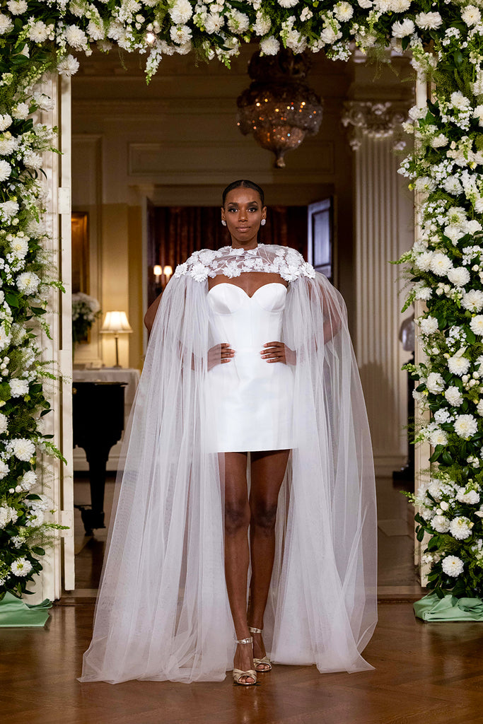 Nardos designed luxury bridal gown - Dallas, TX and New York, NY. Tule cape over a satin corset mini dress