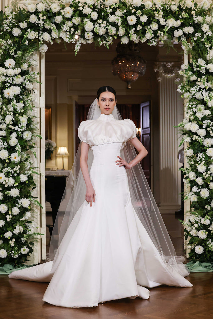 Nardos designed luxury bridal gown - Dallas, TX and New York, NY. Trumpet styled dress with a puff sleeve topper.