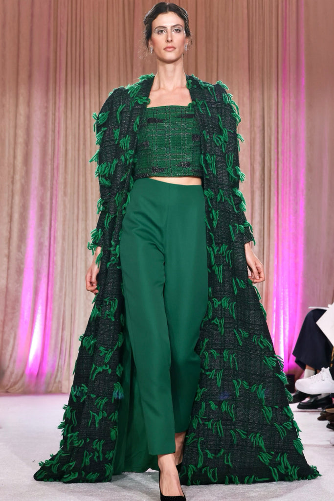 Nardos designed set with a long tweed coat with kelly green fringe, kelly green pencil pants, and a sleeves tweed top