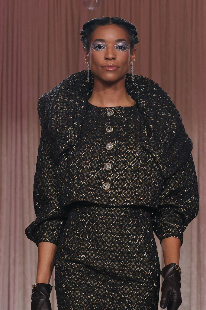 Nardos designed diamond pattern metallic jacquard set with jewel button closures of the jacket with a long subtle flare pencil skirt